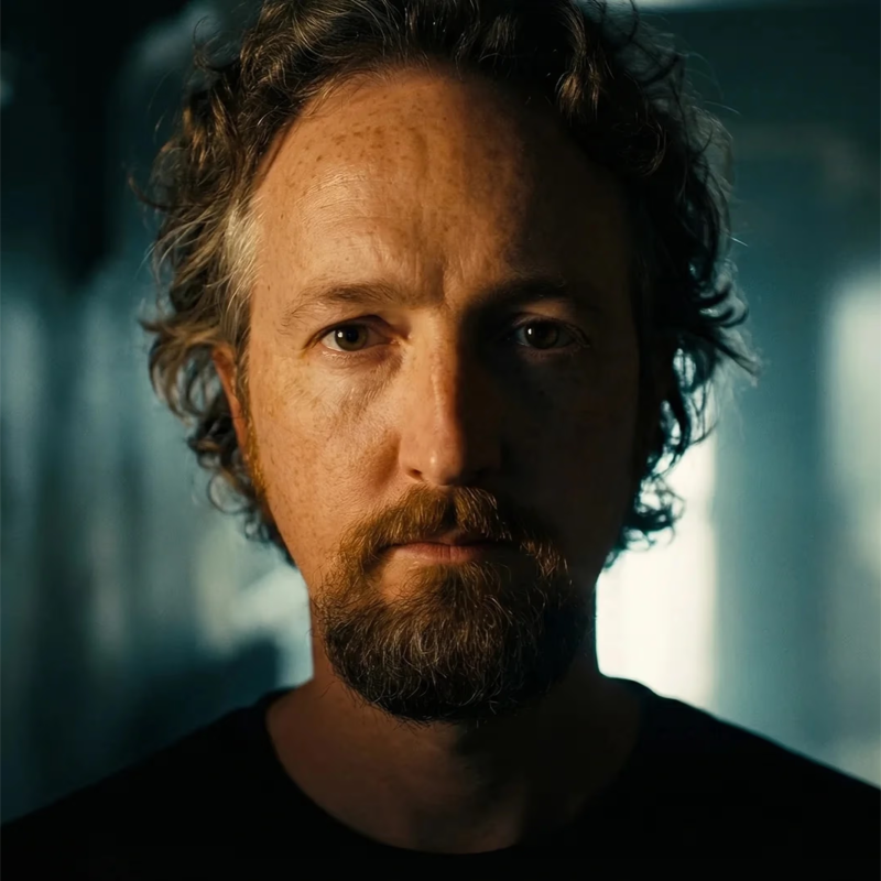 Original portrait with styled hair and dramatic side lighting